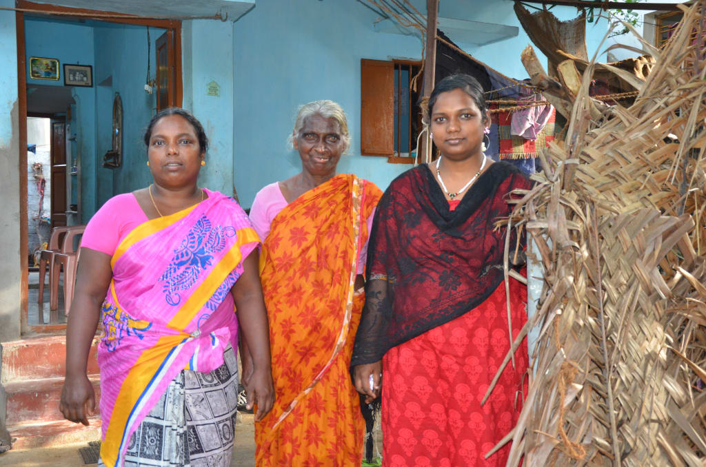 Ramya with her mother and grandmother who became maids to support the family when Ramya's father was paralyzed.